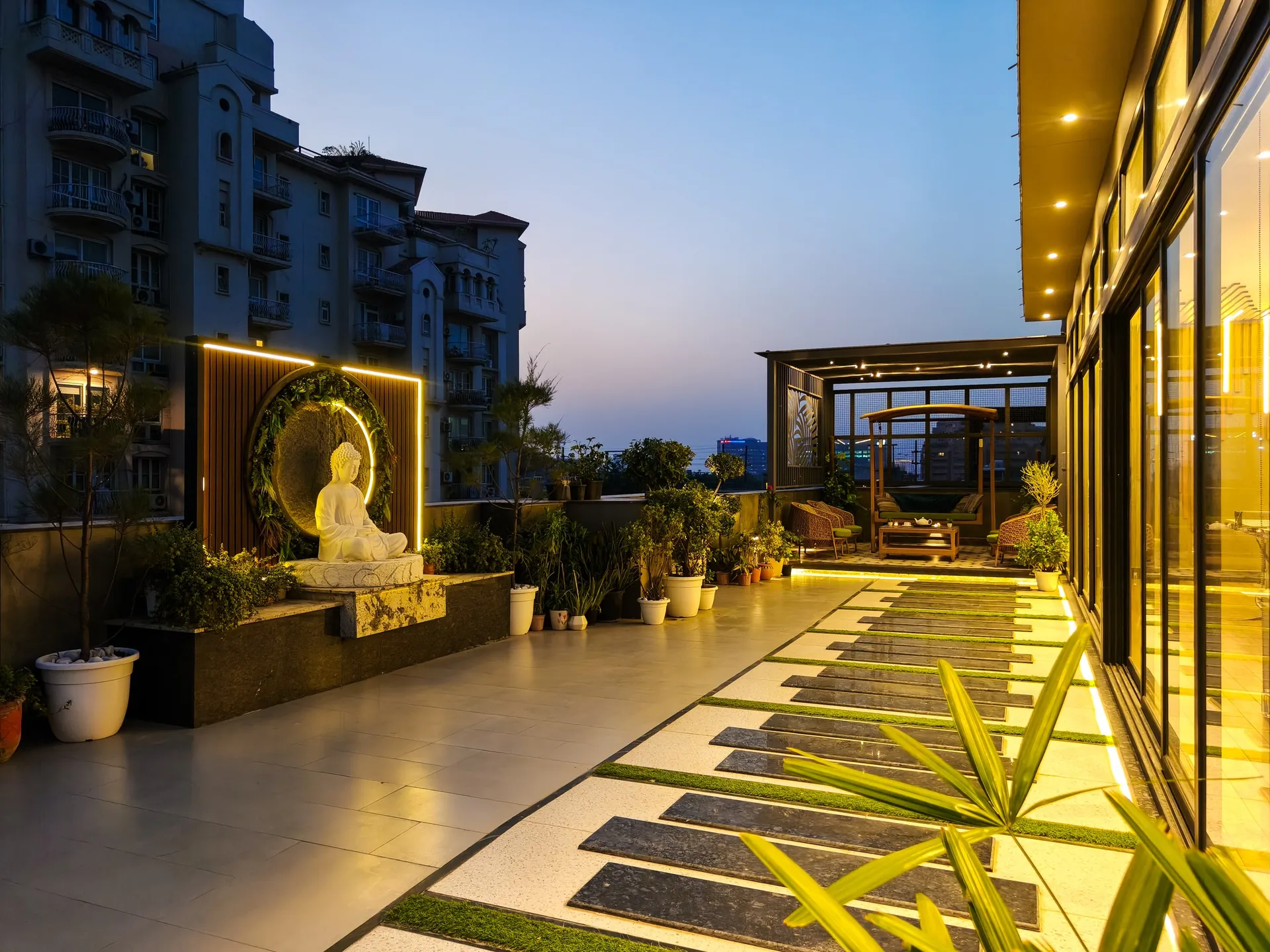 Lit pergola lounge and terrace at dusk by LifeWall