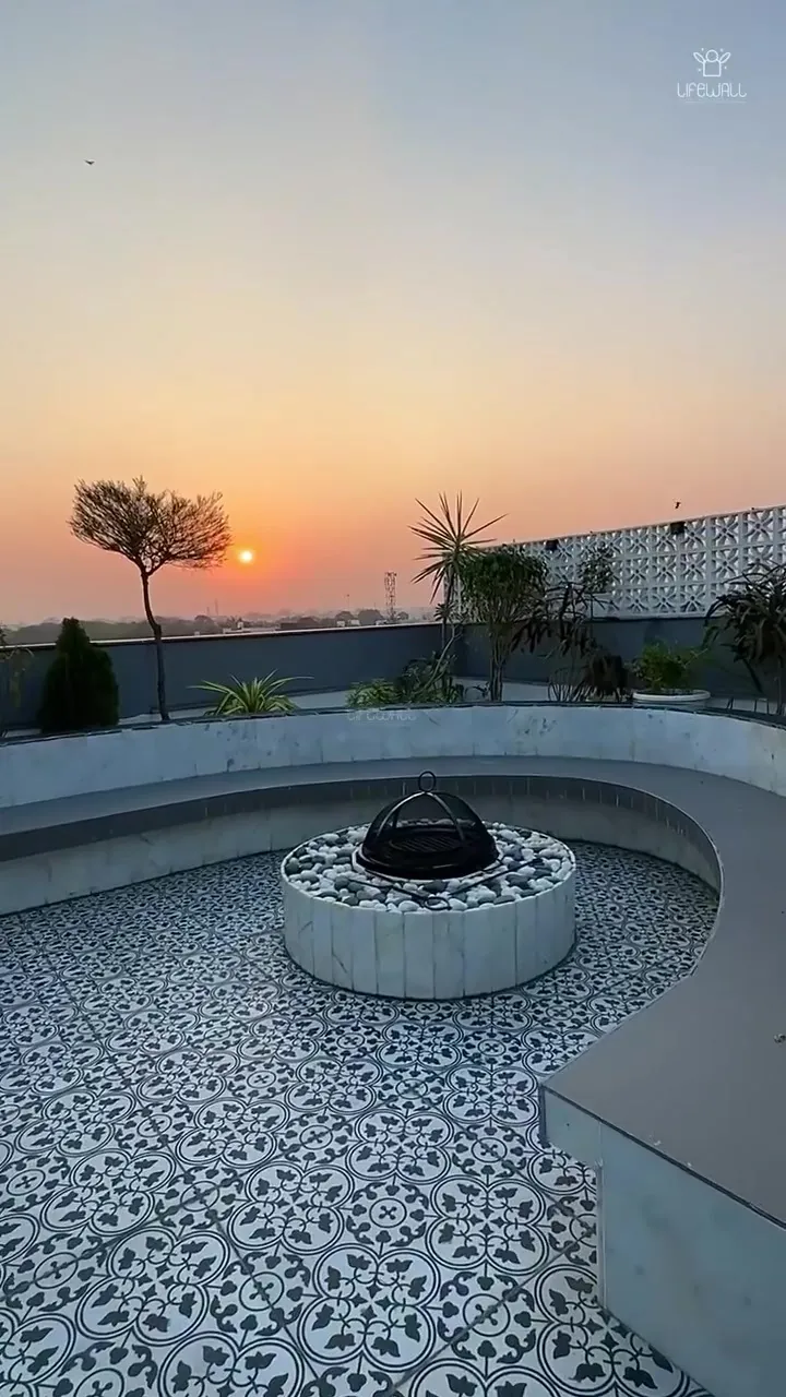 Film of a terrace with moon gate and fire pit